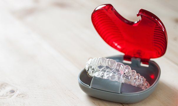 Invisalign trays in red case