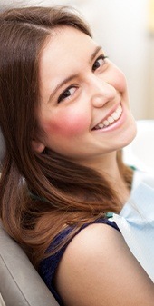 Woman smiling at camera during preventive dentistry visit