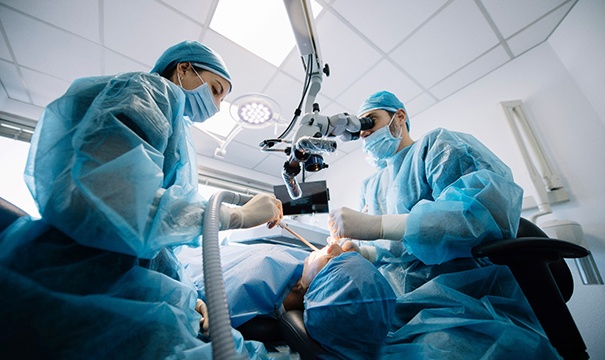 an oral surgeon performing a dental implant procedure in Attleboro