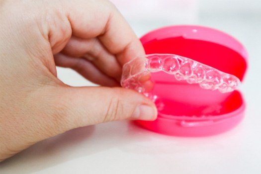Invisalign in a pink case