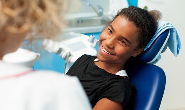 girl smiling at dentist