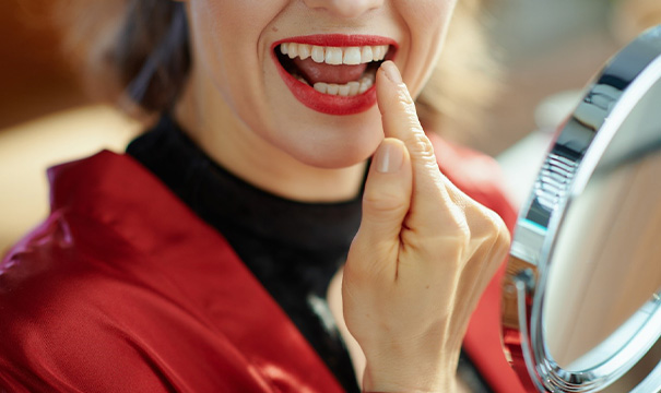 Dentist using curing light on cosmetic bonding