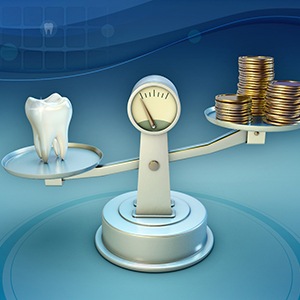 Tooth and coins on balance scale