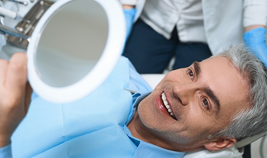 Man smiling at the dentist