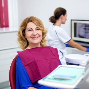 dentist looking at a patient’s X-rays