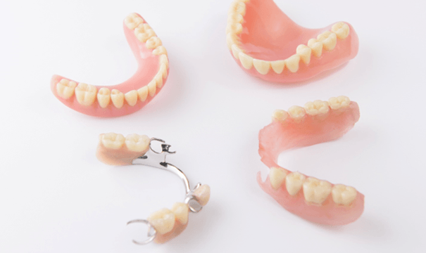 Different types of dentures in Attleboro on white background 