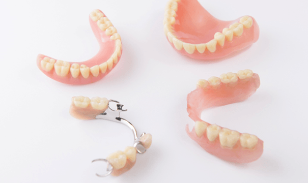 Different types of dentures in Attleboro on white background