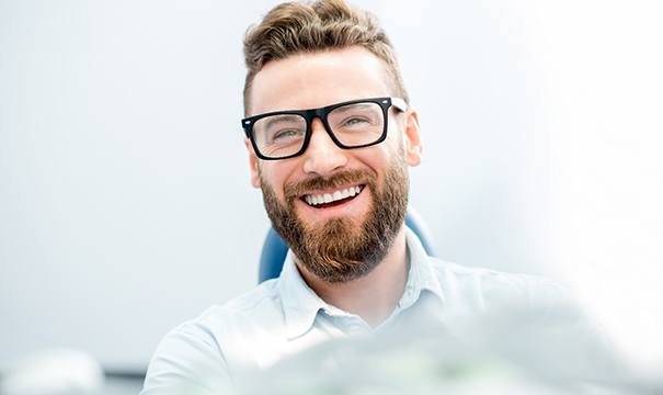 patient smiling in treatment chair 