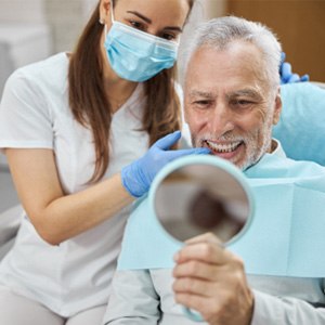 An aging gentleman happy with his new dental implant