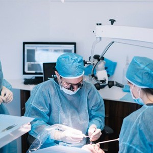 an oral surgeon placing a dental implant