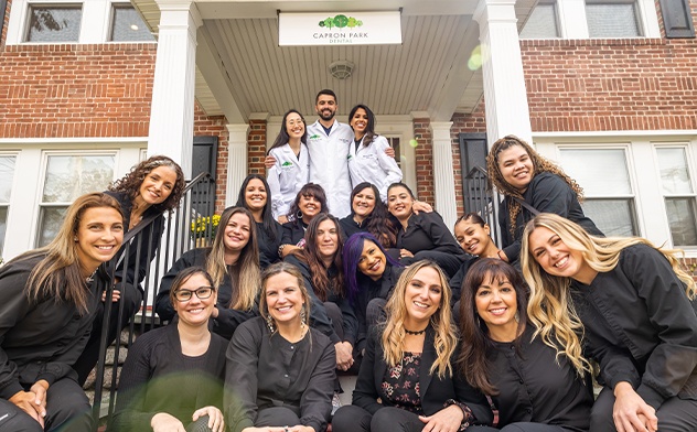 Attleboro dental team standing outside of dental office building