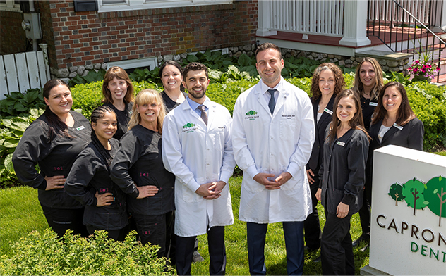 Attleboro dental team standing outside of dental office building