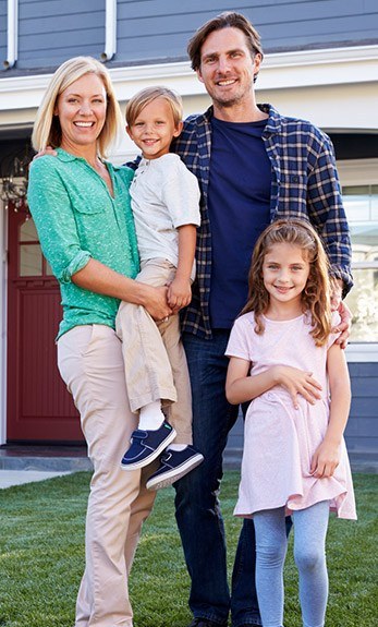 family of four smiling