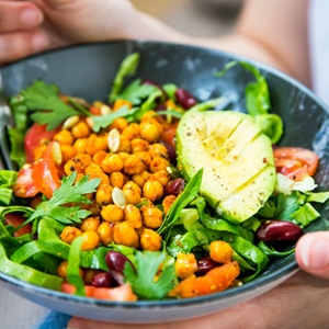 a person eating a salad