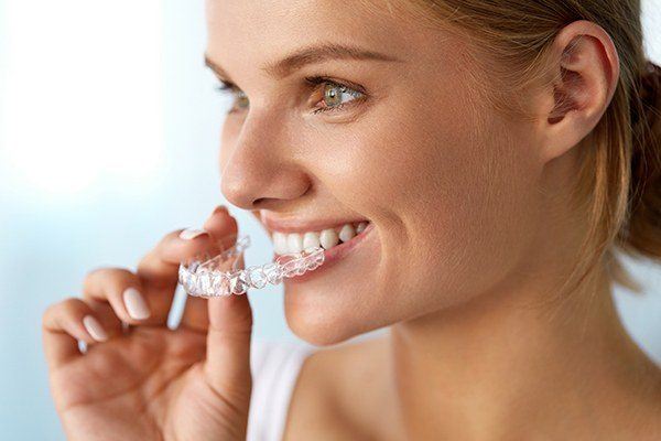 woman using clear aligners