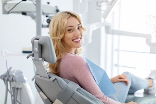 Closeup of smiling patient sitting in treatment chairy