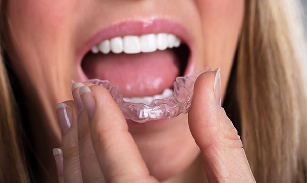 woman putting in clear correct