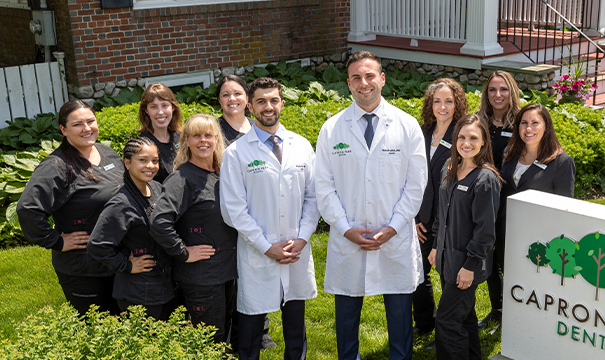 Parents and two children with healthy smiles after family dentistry