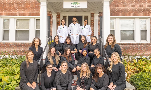 Parents and two children with healthy smiles after family dentistry