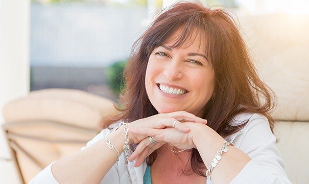 Woman smiling bright after root canal therpay