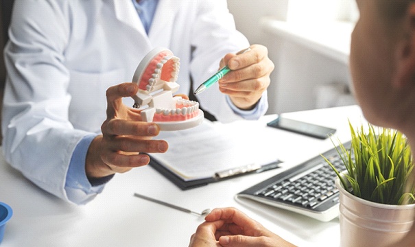 patient talking to dentist about TMJ therapy