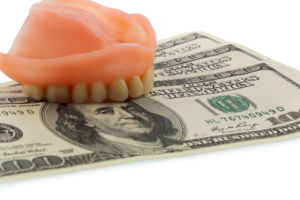 denture on money