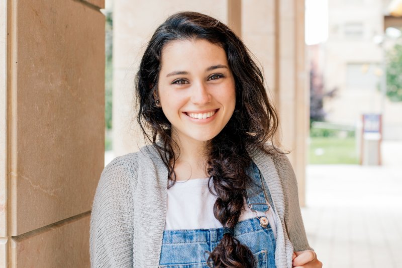 Teenager smiling after cosmetic dentistry