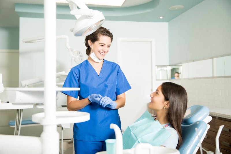 patient asking their dentist in Attleboro treatment questions