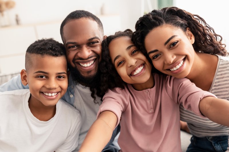 Smiling Family taking a selfie together at home