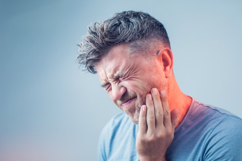 A man suffering from tooth pain